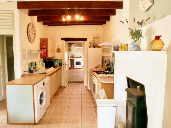 The well equipped kitchen, leading into the adjoining Lavender Cottage